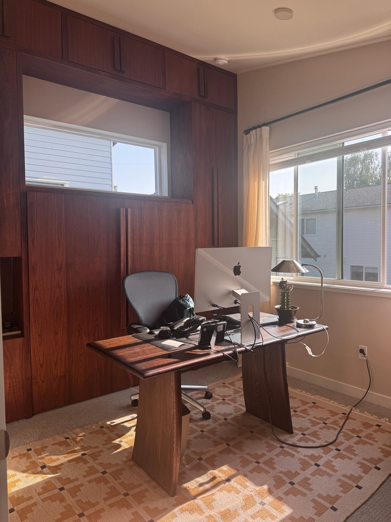 Desk with cable‑management mounted under the top